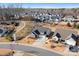 Aerial view of a gray house in a quiet neighborhood with manicured lawns at 5367 Heartwood Ln, Denver, NC 28037