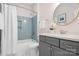 Well-lit bathroom featuring a vanity with framed cabinets, a large mirror, and a shower-tub combination at 5367 Heartwood Ln, Denver, NC 28037