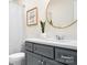 Stylish bathroom features gray vanity, modern mirror, and clean lines for a contemporary feel at 5367 Heartwood Ln, Denver, NC 28037