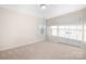 Neutral bedroom offers carpet, a window view and closet doors creating a clean and spacious atmosphere at 5367 Heartwood Ln, Denver, NC 28037