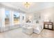 Bright bedroom with a chandelier, large windows, and neutral decor at 5367 Heartwood Ln, Denver, NC 28037