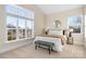 Bright bedroom with lots of natural light, carpet, and a comfortable queen-sized bed at 5367 Heartwood Ln, Denver, NC 28037