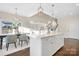 Open concept kitchen island with modern cabinetry and hardwood floors at 5367 Heartwood Ln, Denver, NC 28037