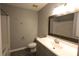 This bathroom features a white vanity, a large mirror, and a shower-tub combination at 5809 Carolina Manor Ct, Indian Trail, NC 28079