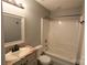 Cozy bathroom with updated vanity, framed mirror and shower-tub combination at 5809 Carolina Manor Ct, Indian Trail, NC 28079