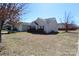 A cozy home with a well-maintained yard under a clear blue sky at 5809 Carolina Manor Ct, Indian Trail, NC 28079