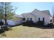 Charming single-story home featuring a manicured lawn and attached garage at 5809 Carolina Manor Ct, Indian Trail, NC 28079