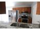 Kitchen with granite countertop, stainless steel appliances, and wooden cabinets at 5809 Carolina Manor Ct, Indian Trail, NC 28079
