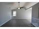 Bright living room featuring vaulted ceiling, neutral paint, and tile flooring at 5809 Carolina Manor Ct, Indian Trail, NC 28079