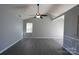 Bright living room featuring vaulted ceiling, neutral paint, and tile flooring at 5809 Carolina Manor Ct, Indian Trail, NC 28079