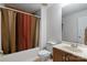 Cozy bathroom with tub, shower with colorful curtain, toilet, vanity, and mirror at 5912 Potter S Rd, Waxhaw, NC 28173