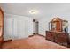 Bright bedroom featuring hardwood trim, paneled walls, closet and a window that filters in natural light at 5912 Potter S Rd, Waxhaw, NC 28173