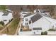 Aerial exterior showcasing the rear of homes with fenced yards and patios at 7138 Stonington Ln, Charlotte, NC 28227