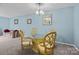 Living room with a decorative dinette set, furniture, and blue walls at 7138 Stonington Ln, Charlotte, NC 28227