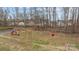 Community playground featuring slides, swings, and climbing structures for Gathering fun at 7138 Stonington Ln, Charlotte, NC 28227