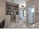 The bathroom features a walk in shower, tub, and modern light fixtures at 8017 Talcott Dr, Mint Hill, NC 28227