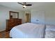 Bedroom featuring a bed, dresser, double closet, and doorway to the bathroom at 8017 Talcott Dr, Mint Hill, NC 28227