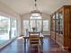 Bright dining room with a view of the deck and backyard through large windows at 8017 Talcott Dr, Mint Hill, NC 28227