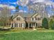 Charming two-story brick home with well-maintained landscaping and a welcoming entrance at 8017 Talcott Dr, Mint Hill, NC 28227