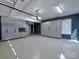Large garage with speckled floors, gray cabinetry, and plenty of storage at 8017 Talcott Dr, Mint Hill, NC 28227