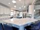 Bright kitchen featuring white cabinetry, stainless steel appliances, and a large center island at 8017 Talcott Dr, Mint Hill, NC 28227
