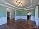 Open-concept living space featuring hardwood floors, decorative trim, and recessed lighting at 8017 Talcott Dr, Mint Hill, NC 28227