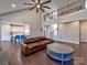 Open living space with a modern kitchen, cozy seating, and wood floors at 8017 Talcott Dr, Mint Hill, NC 28227
