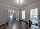Bright office space with hardwood floors, custom lighting, and abundant natural light at 8017 Talcott Dr, Mint Hill, NC 28227