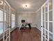 Spacious office featuring French doors, hardwood floors, and plenty of natural light at 8017 Talcott Dr, Mint Hill, NC 28227