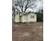 Exterior view of home with small windows and door entrance; the backyard is currently bare at 821 S Oakland St, Gastonia, NC 28054