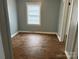 Bedroom featuring hardwood floors and a window with blinds at 821 S Oakland St, Gastonia, NC 28054
