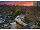 Aerial view of the property showcasing the house, surrounding neighborhood, and the city skyline in the background at 846 Wriston Pl, Charlotte, NC 28209