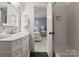 Bathroom with a marble vanity, subway tile, and an open doorway to a bedroom at 846 Wriston Pl, Charlotte, NC 28209