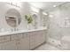 Luxurious bathroom with double sinks, granite countertops, and a modern glass-enclosed shower at 846 Wriston Pl, Charlotte, NC 28209