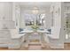 Bright breakfast nook with custom bench seating and a large window at 846 Wriston Pl, Charlotte, NC 28209