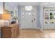 Bright entryway with a crystal chandelier, stylish console table, and beautiful hardwood floors at 846 Wriston Pl, Charlotte, NC 28209