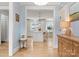 Welcoming entryway offering a glimpse into a bright, white kitchen with a center island at 846 Wriston Pl, Charlotte, NC 28209