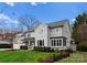 Stunning two-story home with a manicured lawn, charming landscaping and a white picket fence at 846 Wriston Pl, Charlotte, NC 28209