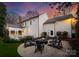 Backyard firepit with seating creating an inviting outdoor gathering space, surrounded by gravel and landscaping at 846 Wriston Pl, Charlotte, NC 28209