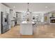 Spacious kitchen with white cabinets, stainless steel appliances, a center island, and an eat-in area at 846 Wriston Pl, Charlotte, NC 28209