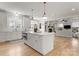 Open kitchen with a large island and seating, flowing into the living area at 846 Wriston Pl, Charlotte, NC 28209