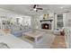 Cozy living room featuring a fireplace, hardwood floors, and access to the kitchen at 846 Wriston Pl, Charlotte, NC 28209