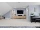 Open-concept living room features a large TV, neutral colors, and access to other parts of the home at 846 Wriston Pl, Charlotte, NC 28209