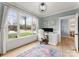 Bright home office with large windows, stylish desk, hardwood floors, and modern decor at 846 Wriston Pl, Charlotte, NC 28209