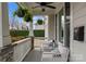 Inviting porch with comfortable seating, hanging plants, ceiling fan and a view of a private yard at 846 Wriston Pl, Charlotte, NC 28209