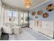 Bright sunroom features lots of natural light with decorative wall art and chair with ottoman at 846 Wriston Pl, Charlotte, NC 28209