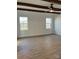 Bedroom with exposed wood beams, and a large window overlooking the property at 8827 Wingard Rd, Waxhaw, NC 28173