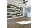 Bonus room with an accent wall, neutral paint colors, recessed lighting, and wood-look flooring at 8827 Wingard Rd, Waxhaw, NC 28173