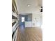 Bonus room with an accent wall, neutral paint colors, and wood-look flooring at 8827 Wingard Rd, Waxhaw, NC 28173