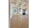 This dining room features a modern light fixture, hardwood floors, and ample natural light at 8827 Wingard Rd, Waxhaw, NC 28173